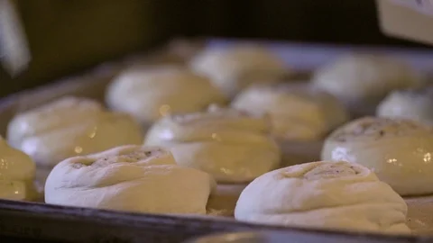 Chef greasing dough in baking tray Stock Footage 87700498
