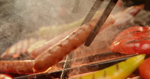 Chef grilling beef sausages 스톡 동영상 311829359