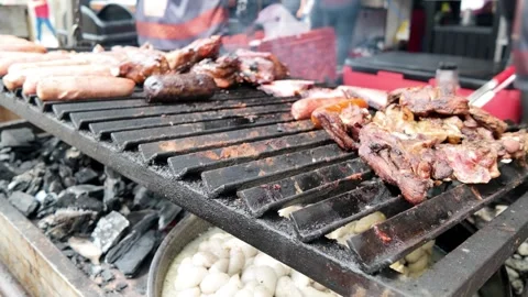 Chef grilling beef steak at barbecue dinner party outside - Close up male hands Stock Footage 335186161