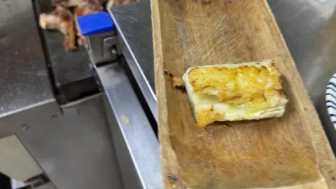 Chef grilling lamb chops and cheese mochi in a restaurant kitchen 스톡 동영상 344100298