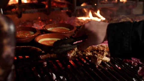 Chef grilling meat on barbecue in slow motion Stock-Footage 297801236