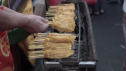 Chef grilling pork satay. slow motion. Stock Footage 250466881