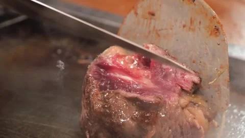 Chef Grilling Premium Wagyu Beef Steak on Hot Teppanyaki Grill, Close-Up Stock Footage 333521247