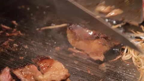 Chef Grilling Premium Wagyu Beef Steak on Hot Teppanyaki Grill, Close-Up Stock Footage 333521276