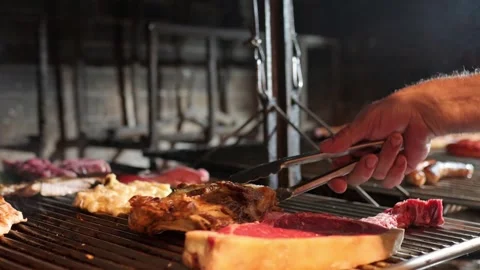 Chef grilling ribs, provolone and sausages on barbecue Stock Footage 296502460