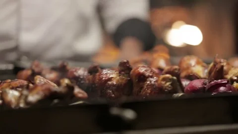 Chef grilling skewered meat on barbeque Stock Footage 72981490