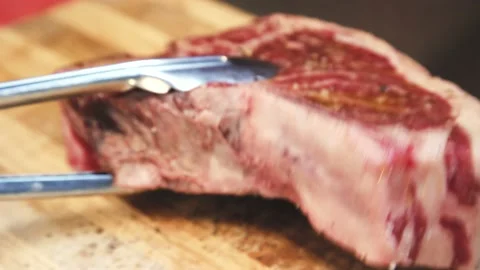 The chef is grilling steak Stock Footage 130988650
