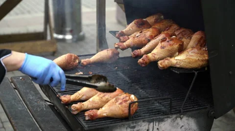 Chef is grilling Turkey legs on the grill. Appetizing, Stock Footage 68623639