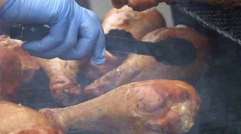Chef is grilling Turkey legs on the grill. Appetizing, Zoom out. Stock Footage 68623665