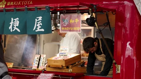Chef Grilling Wagyu Beef at a Tokyo Street Food Stall Stock Footage 342468780