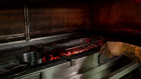 Chef Grilling Whole Fish Over Charcoal in Restaurant Kitchen Close Up Stock Footage 337987741