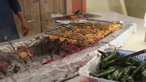 The chef grills kebabs with rice and vegetables Stock Footage 335198546