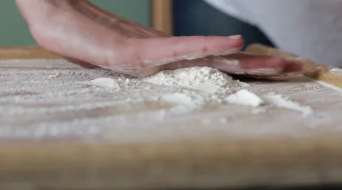 Chef grind flour on the table Stock Footage 62354639