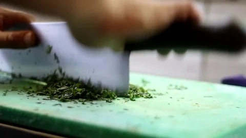 Chef Hand Cutting Fresh Basil Stock Footage 82939772