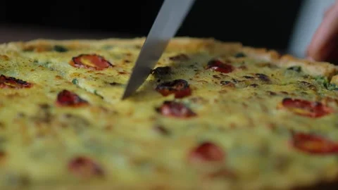 Chef hand cutting quiche or French tart. Stock Footage 131548067