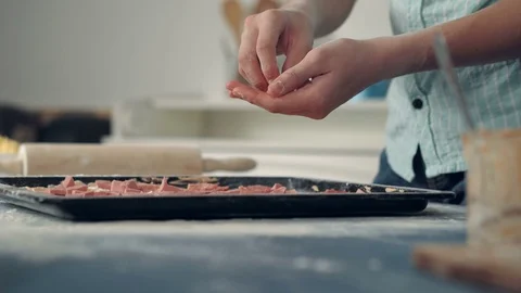 Chef hand placing ingredients on pizza Stock Footage 72545261