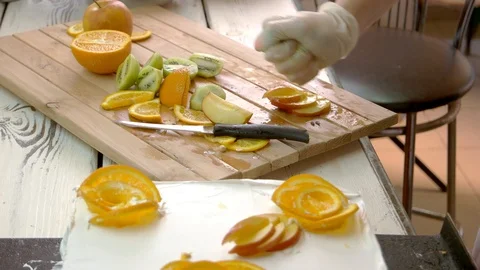 Chef hand processing apple slices with lemon juice. Stock Footage 93086878