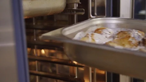Chef hand putting metal container with baked chicken in white sour cream sause Video stock 123271489