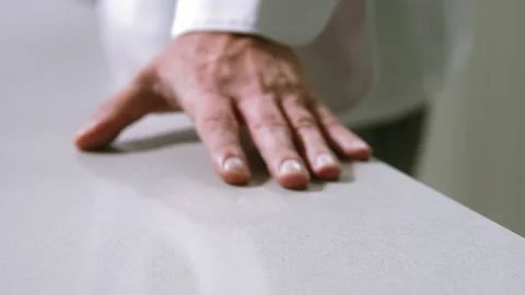 Chef hand sleeking on the table Stock Footage 221145836