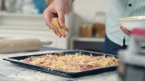 Chef hand sprinkle pizza with cheese Stock Footage 72546179