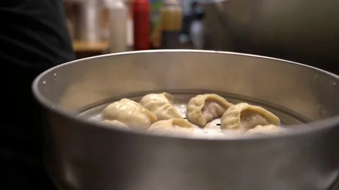Chef handling dumplings Stock Footage 142724381