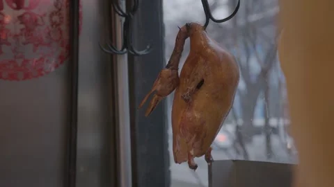Chef Handling Roasted Duck in Beijing Restaurant Kitchen by Window Stock Footage 345767756