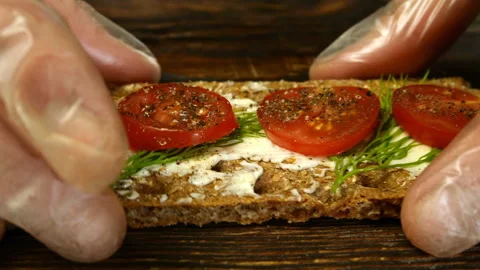 Chef hands break in half crispbread with butter. Stock Footage 133158812