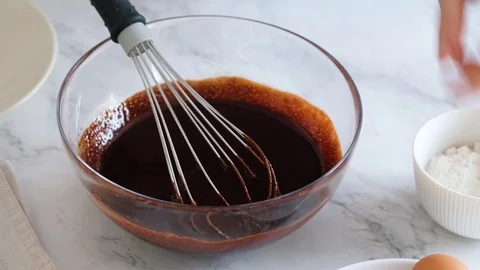 Chef hands breaking egg. Egg break in slow motion. Making homemade chocolate Stock Footage 121109800