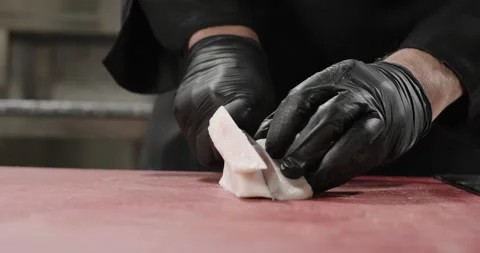 Chef hands chop sheep tail fat on a cutting board. Close-up Stock Footage 274579418