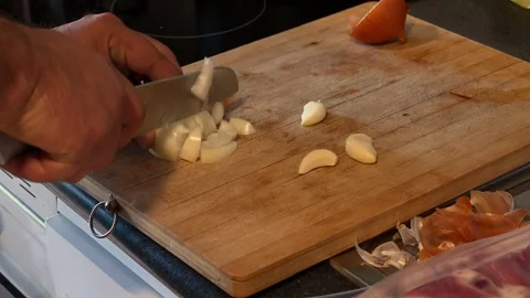 Chef hands chopping fresh onion with knife Stock Footage 336486540