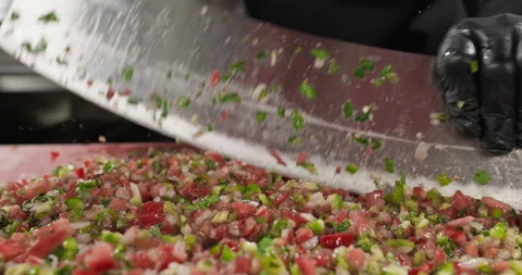 Chef hands chopping vegetables with a big knife, preparing traditional Turkish Stock Footage 294218830