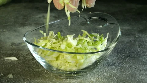 Chef with hands crushed and mixed fresh young cabbage. Vídeo Stock 132024249