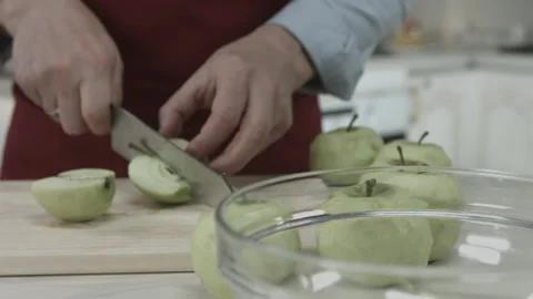 Chef Hands Cutting Peeled Apple with Knife Tool Video stock 160978119