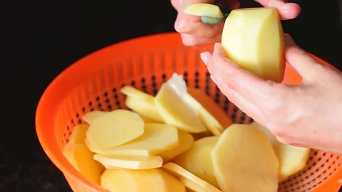 Chef hands cutting potatoes Stock Footage 129817151