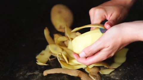 Chef hands cutting potatoes Stock Footage 129817159