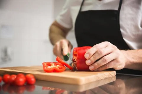 Chef hands cutting red pepper Stock Photos