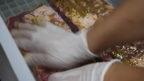 Chef Hands In Gloves Marinating Raw Pork Ribs With Spices Stock-Footage 332810775