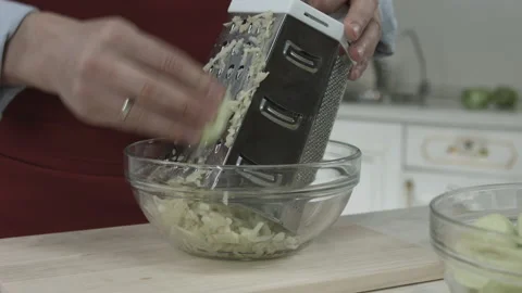 Chef Hands Grate Apple for Cooking Pie Dessert Stock Footage 160963209