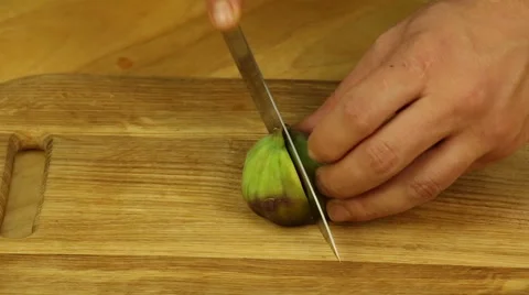 Chef hands with knife cut figs Stock Footage 68784339