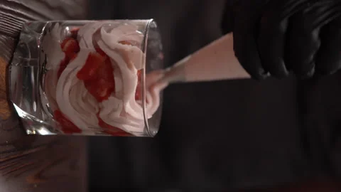 Chef hands making dessert in glass with pastry tools like a pastry bag Stock Footage 250169816