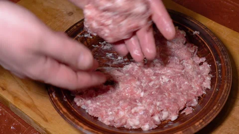 Chef hands  mix minced meat with spices in plate Видео 247842629