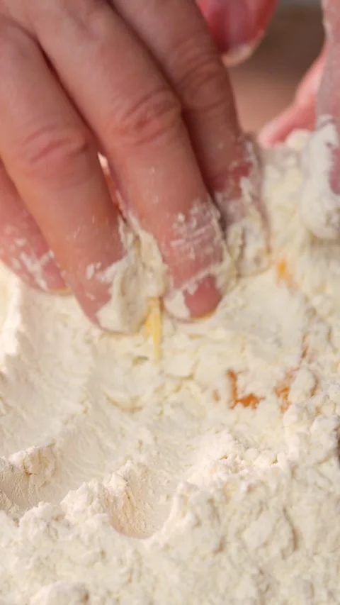 Chef Hands Mix Raw Egg Yolk Into White Flour Carefully On Wooden Table. Baker Stock Footage 346765116