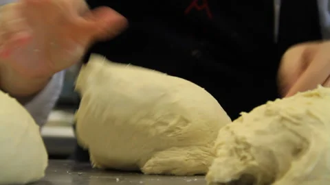 Chef hands molding bread dough closeup shot Stock Footage 139106173