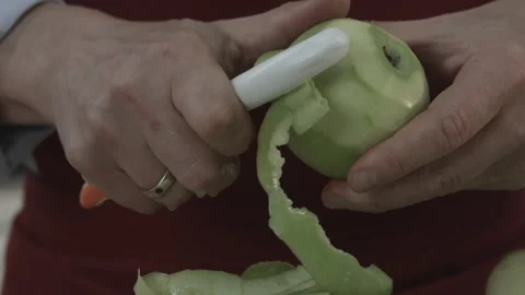 Chef Hands Peeling Apple with Peeler Kitchen Tool Stock Footage 160963812