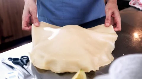 Chef hands placing pie crust over apple filling – Holiday baking, traditional Stock Footage 321563971