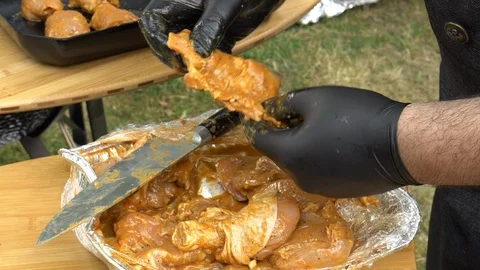 Chef hands prepare chicken meat for baking on barbecue grill. Slow motion shot Stock Footage 109505425