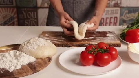 Chef hands prepare pizza dough on a wooden board Stock Footage 132301511
