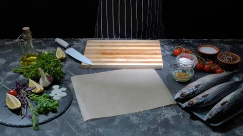 Chef hands prepare raw fish over cutting board Stock Footage 118349438