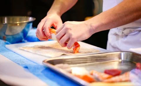 Chef hands preparing japanese food, chef making sushi, Preparing Sushi roll Stock Photos