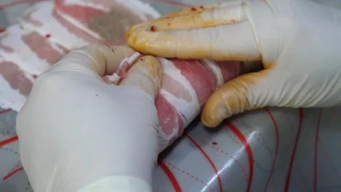 Chef Hands Rolling Thinly Sliced Pork Belly with Shiso Leaves and Cheese Video stock 343588053